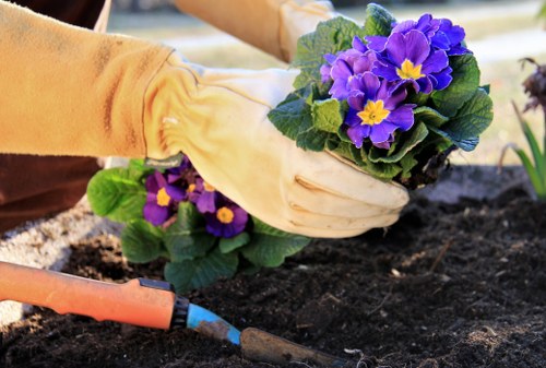 Safe landscaping team organising tools and waste on site